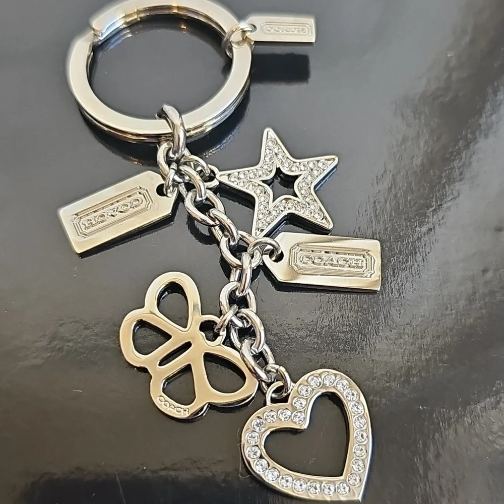 Coach NWOT Silver Keychain with Heart, Star, and Butterfly Charms - Picture 1 of 7